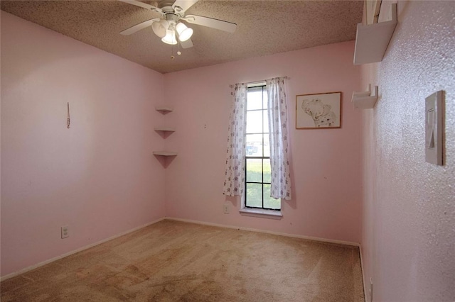 311 August St, Schulenburg, TX 78956 - spare room with ceiling fan, carpet, and a textured ceiling