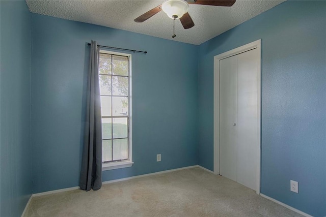 311 August St, Schulenburg, TX 78956 - carpeted empty room featuring a textured ceiling and a ceiling fan