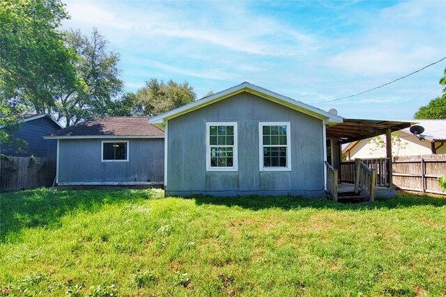 311 August St, Schulenburg, TX 78956 - back of property with fence and a lawn