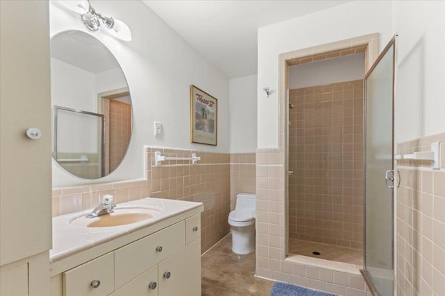 3106 Maywood Ave, Austin, TX 78703 - full bathroom with vanity, tile walls, toilet, a shower stall, and wainscoting
