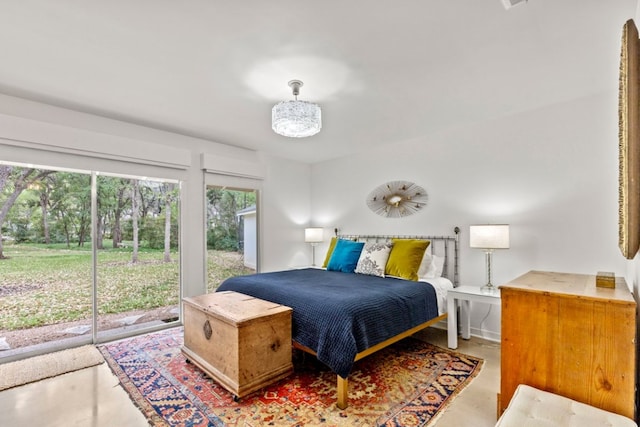 3106 Maywood Ave, Austin, TX 78703 - bedroom with access to exterior and concrete floors