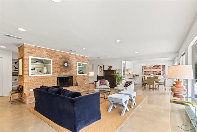 3106 Maywood Ave, Austin, TX 78703 - living area featuring a brick fireplace, concrete flooring, recessed lighting, and brick wall