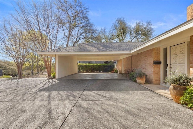 3106 Maywood Ave, Austin, TX 78703 - view of parking / parking lot featuring driveway and an attached carport
