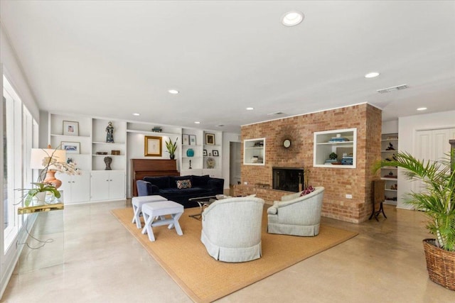 3106 Maywood Ave, Austin, TX 78703 - living room with a fireplace, built in features, healthy amount of natural light, recessed lighting, and concrete floors