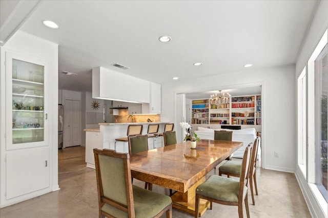3106 Maywood Ave, Austin, TX 78703 - dining space with a chandelier, recessed lighting, and healthy amount of natural light