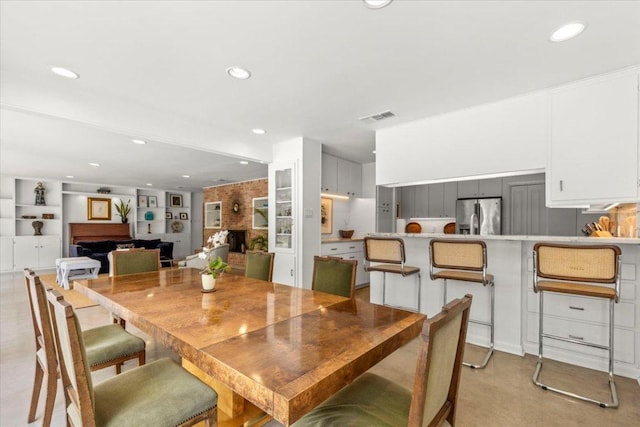 3106 Maywood Ave, Austin, TX 78703 - dining room with a fireplace and recessed lighting