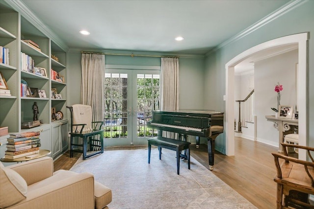 1710 Mccall Rd, Austin, TX 78703 - sitting room with arched walkways, french doors, ornamental molding, wood finished floors, and recessed lighting