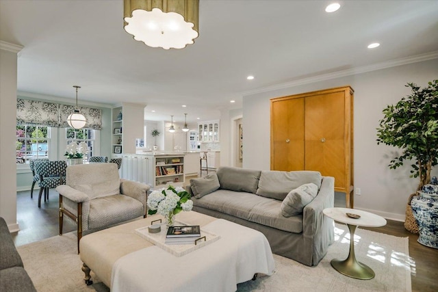 1710 Mccall Rd, Austin, TX 78703 - living room with wood finished floors, recessed lighting, and ornamental molding