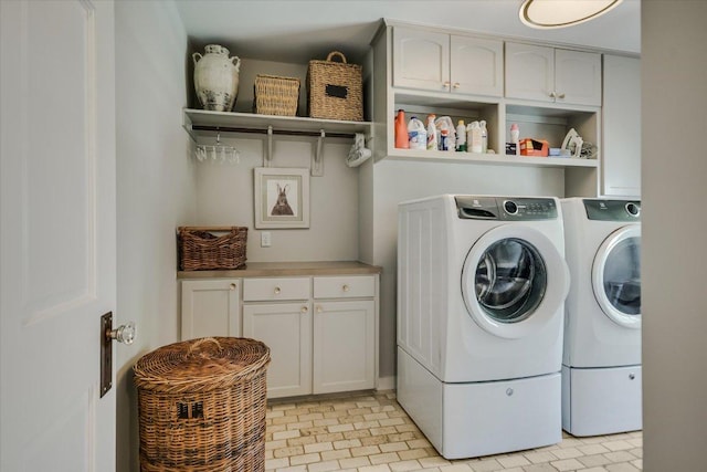 1710 Mccall Rd, Austin, TX 78703 - laundry room featuring cabinet space and washer and clothes dryer