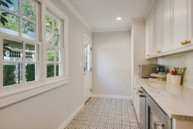 1710 Mccall Rd, Austin, TX 78703 - entryway with light floors, ornamental molding, recessed lighting, and beverage cooler