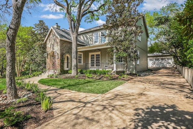 1710 Mccall Rd, Austin, TX 78703 - view of front facade featuring a porch, french doors, and an outbuilding