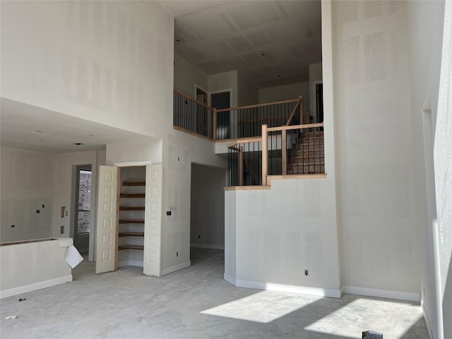 937 Sunny Ridge Dr, Leander, TX 78641 - unfurnished bedroom with a high ceiling and baseboards