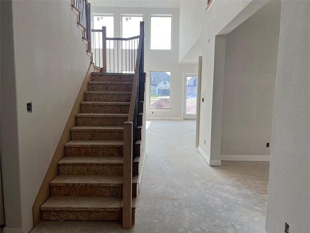 937 Sunny Ridge Dr, Leander, TX 78641 - stairway with concrete flooring and baseboards