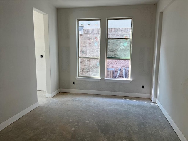 937 Sunny Ridge Dr, Leander, TX 78641 - spare room with healthy amount of natural light and unfinished concrete floors