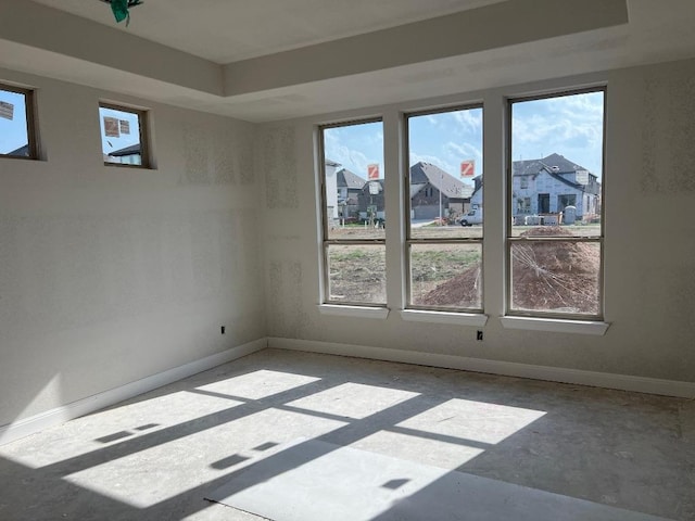 937 Sunny Ridge Dr, Leander, TX 78641 - unfurnished room featuring a residential view and a tray ceiling