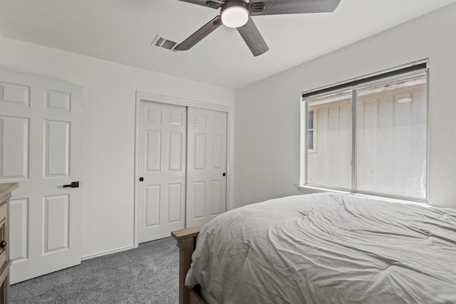 bedroom with visible vents, a ceiling fan, carpet, and a closet