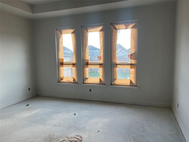 925 Old Garden Rd, Leander, TX 78641 - empty room featuring baseboards, a wealth of natural light, and unfinished concrete floors