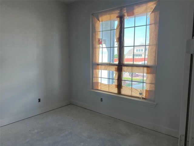 925 Old Garden Rd, Leander, TX 78641 - empty room with baseboards and concrete flooring