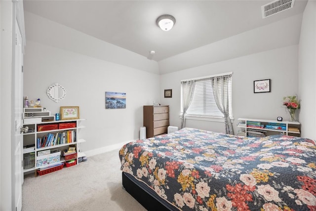 13001 Hymeadow Dr Unit 12, Austin, TX 78729 - carpeted bedroom featuring vaulted ceiling and baseboards