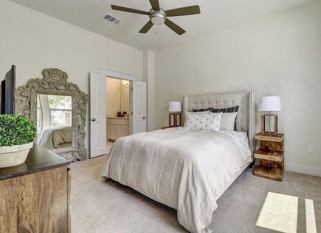 13001 Hymeadow Dr Unit 12, Austin, TX 78729 - carpeted bedroom featuring connected bathroom and ceiling fan