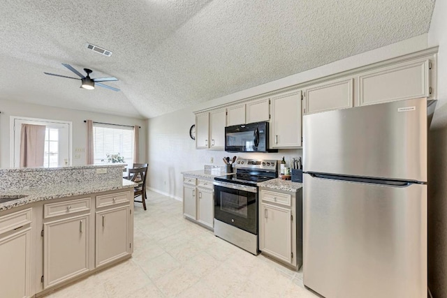602 Totem Trl, Harker Heights, TX 76548 - kitchen with stainless steel appliances, a textured ceiling, a ceiling fan, light stone counters, and vaulted ceiling