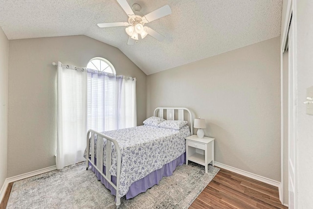 602 Totem Trl, Harker Heights, TX 76548 - bedroom featuring lofted ceiling, wood finished floors, a textured ceiling, and ceiling fan
