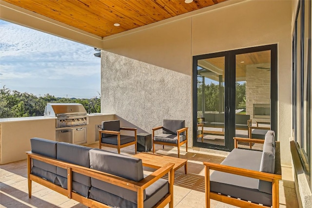 view of patio / terrace featuring a grill, exterior kitchen, and an outdoor hangout area