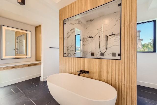 bathroom with a soaking tub, a marble finish shower, wood walls, baseboards, and tile patterned flooring
