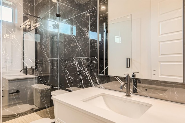 full bathroom with a marble finish shower, vanity, and tile walls