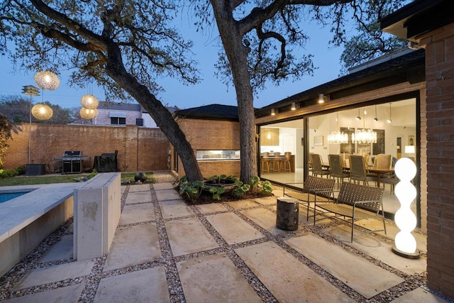 view of patio / terrace featuring a fenced in pool and fence