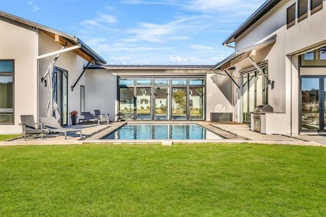 420 Waters Edge Cv, Dripping Springs, TX 78620 - rear view of house featuring a patio area, stucco siding, a lawn, and an outdoor pool