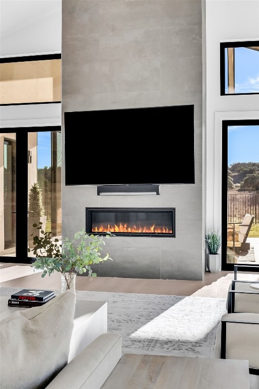 420 Waters Edge Cv, Dripping Springs, TX 78620 - living room featuring a glass covered fireplace