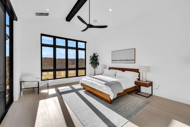 420 Waters Edge Cv, Dripping Springs, TX 78620 - bedroom featuring vaulted ceiling with beams, ceiling fan, visible vents, and wood finished floors