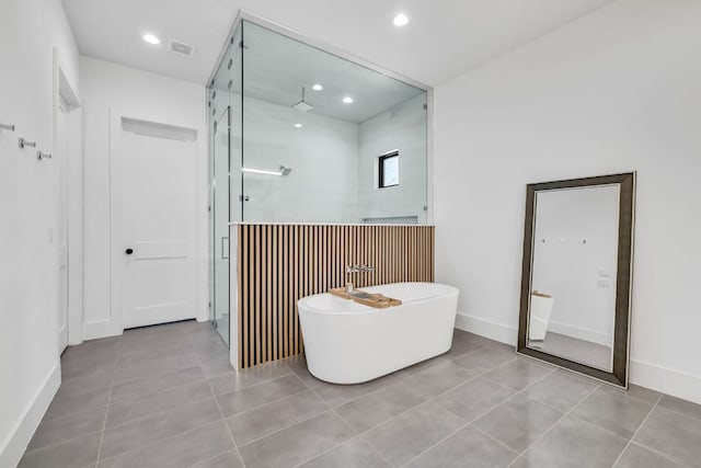 420 Waters Edge Cv, Dripping Springs, TX 78620 - bathroom featuring a freestanding bath, recessed lighting, a walk in shower, and tile patterned floors