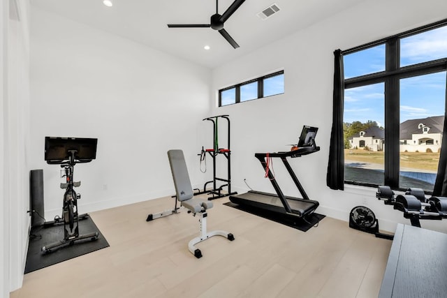 420 Waters Edge Cv, Dripping Springs, TX 78620 - workout room with wood finished floors, visible vents, recessed lighting, a ceiling fan, and baseboards
