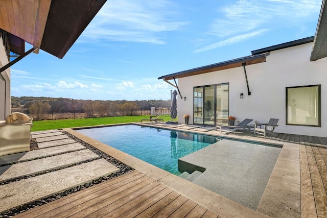 420 Waters Edge Cv, Dripping Springs, TX 78620 - outdoor pool with a patio area, a deck, and a lawn
