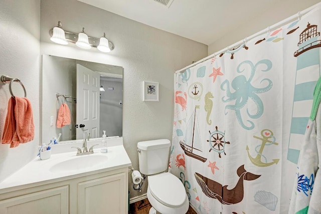 117 Easy St, Hutto, TX 78634 - full bathroom with vanity, toilet, a textured wall, and curtained shower
