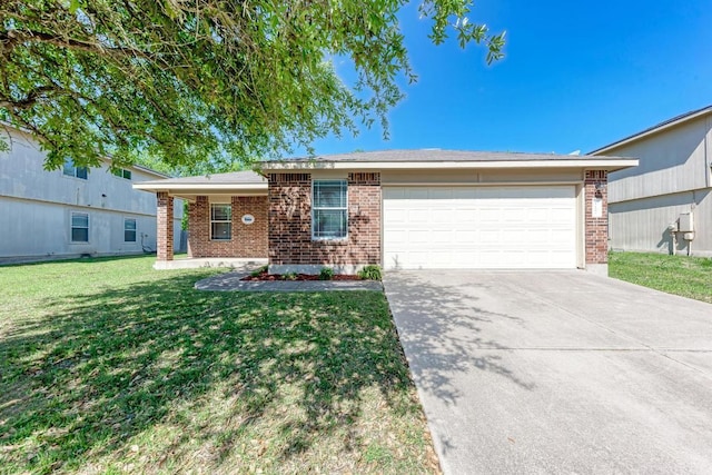 117 Easy St, Hutto, TX 78634 - single story home featuring brick siding, an attached garage, driveway, and a front lawn