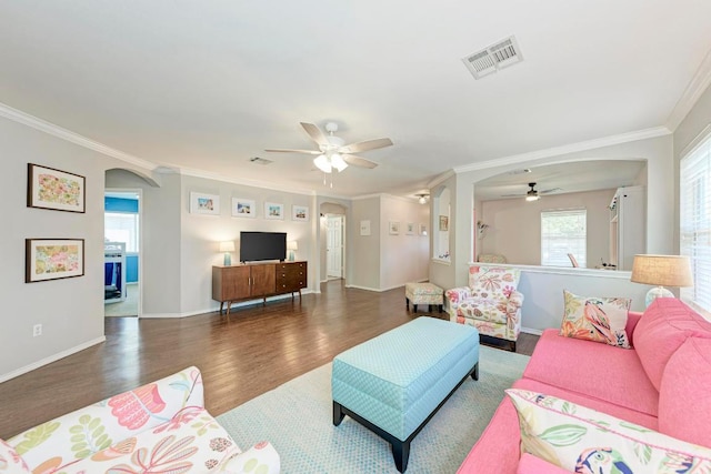117 Easy St, Hutto, TX 78634 - living area with arched walkways, ceiling fan, ornamental molding, wood finished floors, and baseboards