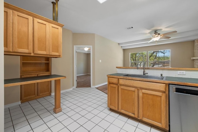 2300 Nevins Cv, Lago Vista, TX 78645 - kitchen with stainless steel dishwasher, ceiling fan, light tile patterned flooring, open shelves, and dark countertops