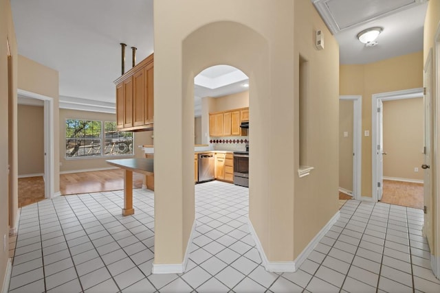 2300 Nevins Cv, Lago Vista, TX 78645 - hall featuring light tile patterned flooring and arched walkways