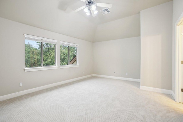 unfurnished room featuring ceiling fan, light carpet, visible vents, and baseboards
