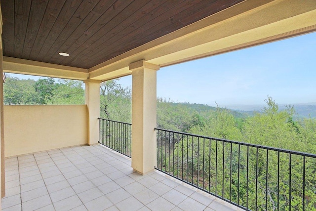 exterior space featuring a wooded view