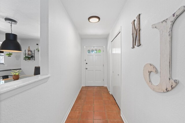 1604 Robb Ln, Round Rock, TX 78664 - hallway with tile patterned floors and baseboards