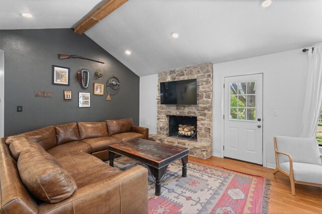 1604 Robb Ln, Round Rock, TX 78664 - living area with baseboards, lofted ceiling with beams, a fireplace, recessed lighting, and light wood-style flooring