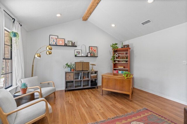 1604 Robb Ln, Round Rock, TX 78664 - sitting room with a healthy amount of sunlight, wood finished floors, lofted ceiling with beams, and visible vents