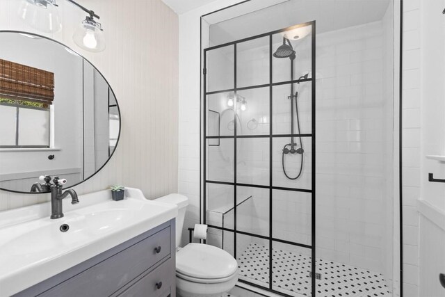 1604 Robb Ln, Round Rock, TX 78664 - bathroom featuring toilet, a tile shower, and vanity