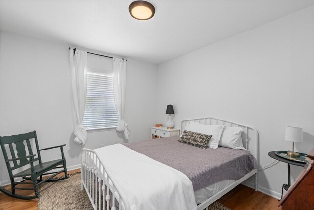 1604 Robb Ln, Round Rock, TX 78664 - bedroom with wood finished floors and baseboards