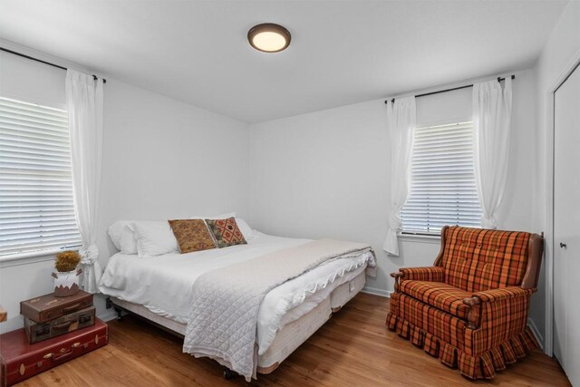1604 Robb Ln, Round Rock, TX 78664 - bedroom with baseboards, multiple windows, and wood finished floors
