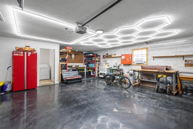 1604 Robb Ln, Round Rock, TX 78664 - garage with washer / clothes dryer, a garage door opener, and a workshop area